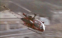 Alouette 2 F-ZBAK equipée civière latérale droite Protection civile survolant la Principauté de Monaco lors d'un Grand Prix dans le documentaire "Fangio Una vita a 300 all'ora" - Photo DR